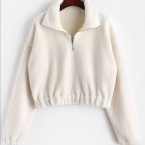 White sherpa half zip pull over jacket